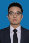 A person in a suit and tie Description automatically generated